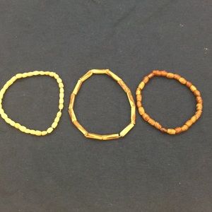 Three wooden bracelets set